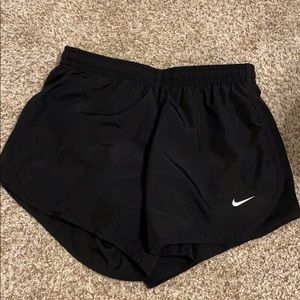 All black YOUTH nike shorts.